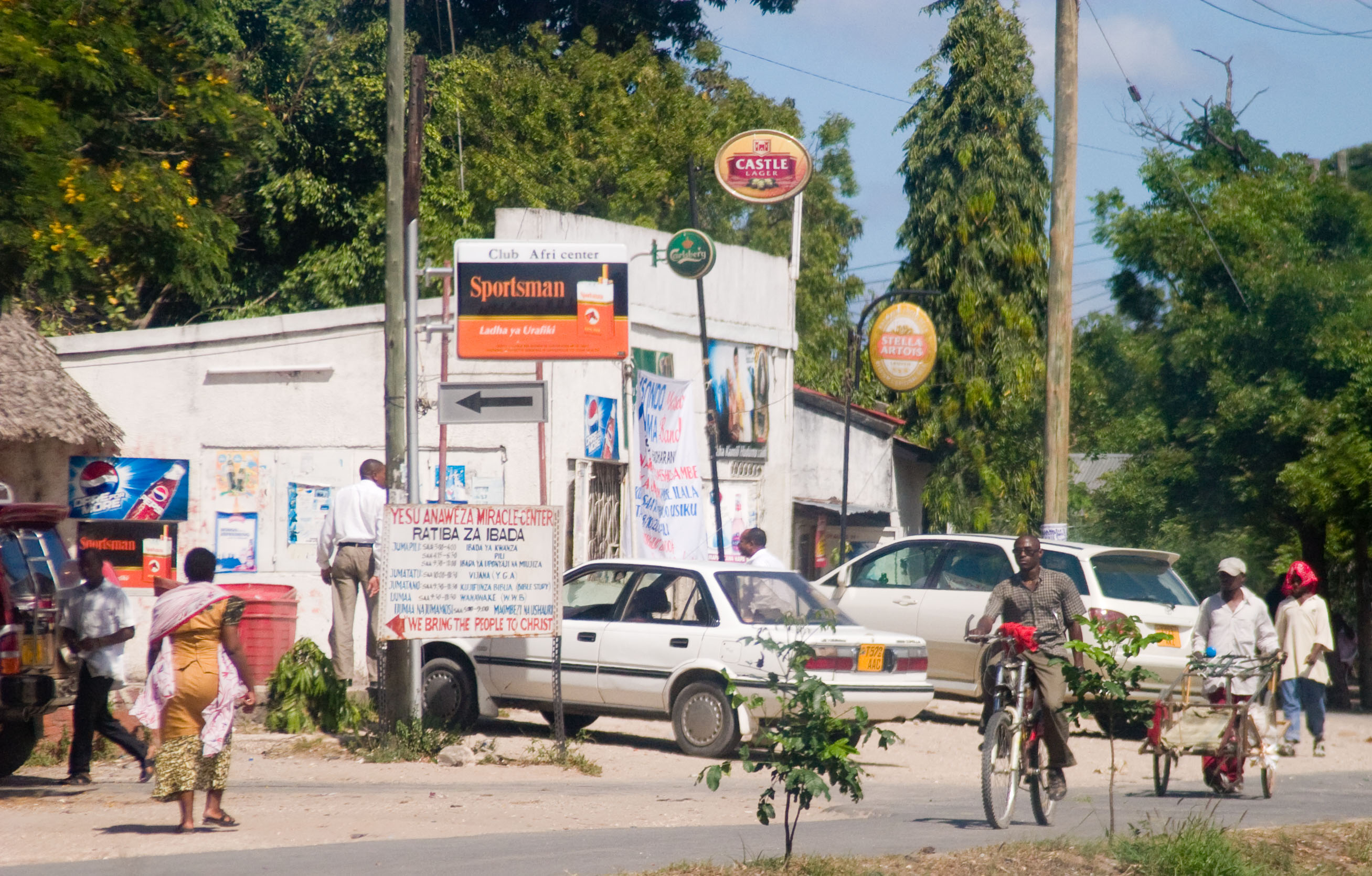 shops in Tanzania with ads for foreign trade marks_Photo by Jon Wiley on Flickr.com