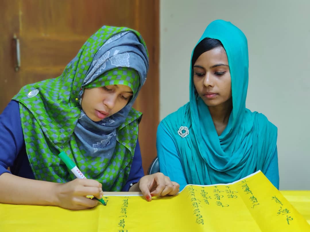 Two female members of a Yoth Water Committee at a training by Uttaran